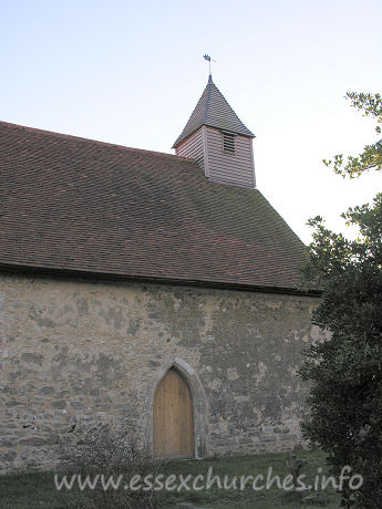 All Saints, Vange Church - The North door, with very tidy belfry sitting atop the church.
