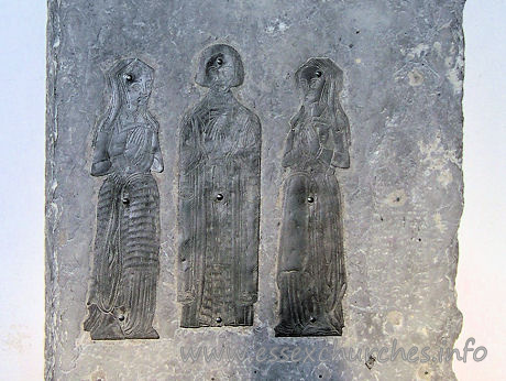 All Saints, Rettendon Church - Brass of c1535, with a civilian and two wives. Sadly, the 
children mentioned in "Essex Churches and Chapels" no longer seem to be present, 
something that has perhaps necessitated the unsightly fixings now used to retain 
these brasses.

	
		Image reproduced by kind
	
	
		permission of Julie Archer. 
	

