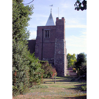St Giles & All Saints, Orsett Church - The W tower occupies the westernmost bay of the N aisle. It is 
partly stone, and partly C17 brick. It has a large diagonal buttresses, and as 
can be seen in this picture, a bulky NW stair-turret. At the top it sports a 
white weather-boarded spire.

