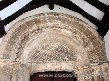 St Giles & All Saints, Orsett Church - The ornate Norman arch above the S doorway.

