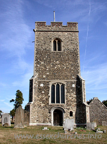 St Mary, Chadwell St Mary Church - Diagonally buttressed tower, with W doorway. Small ogee-headed niche to it's right.