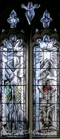 St Mary, Broxted Church - One of two two-light 'hostage' windows by John Clark. This 
window symbolises Captivity. It was put in in 1993 to commemorate the long cruel 
captivity and eventual release of journalist John McCarthy, an active churchman, 
whose home before his kidnapping was the big house next door.

