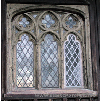 All Saints, Stock Harvard Church - Three-light traceried wooden window.

