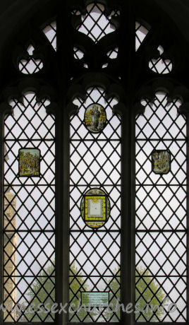 St Nicholas, Elmdon Church - The 17th century painted glass in this window was removed from St Dunstan's Church, Wenden Lofts, during demolition of that church. A.D. 1958.