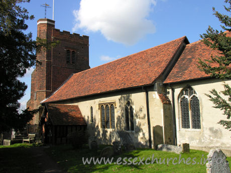 All Saints, Nazeing Church - A similar shot, though this time showing a little of the external chancel wall. The Norman nave window is clearly visible, just to the right of the porch.
 
The fine C16 tower is also evident here, with it's blue diapering, battlements and raised stair turret.
